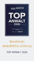 Auszeichnung für exzellente juristische Leistung, "Top Anwalt 2026" auf einer Urkunde.