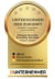 Medaille mit goldener Oberfläche, mit Text "UNTERNEHMEN DER ZUKUNFT, proaktiv, engagiert, zukunftsfähig, Prosave Security & Facility Services, Gültig bis 09/2026" und Logos der Organisationen.